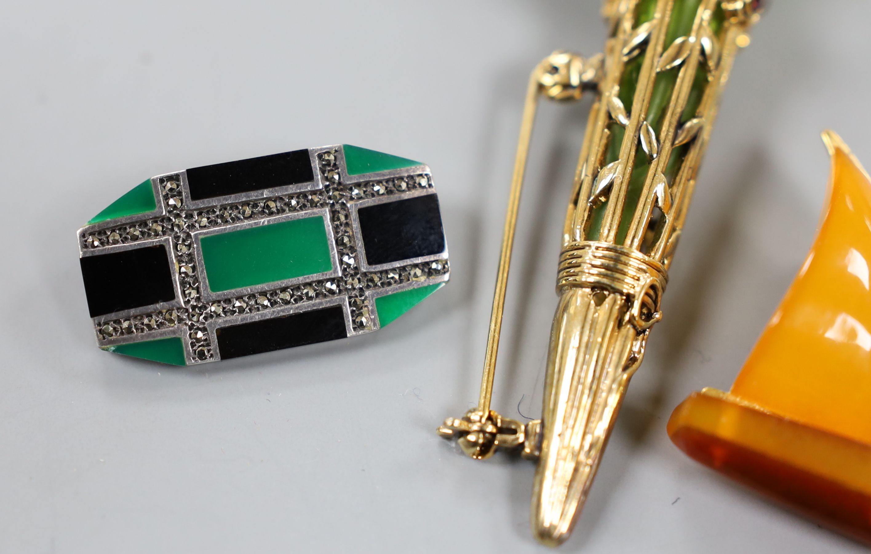 An Art Deco 925, black onyx, chrysoprase? and marcasite set octagonal brooch, 30mm, an amberoid yacht brooch and a gilt metal and paste set posy holder brooch.